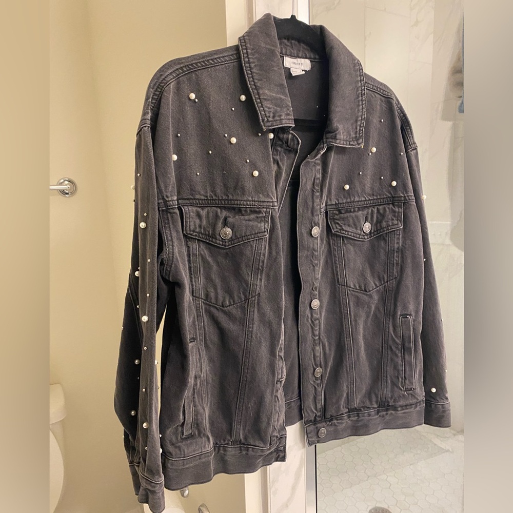 Washed black jean jacket with Pearl accents